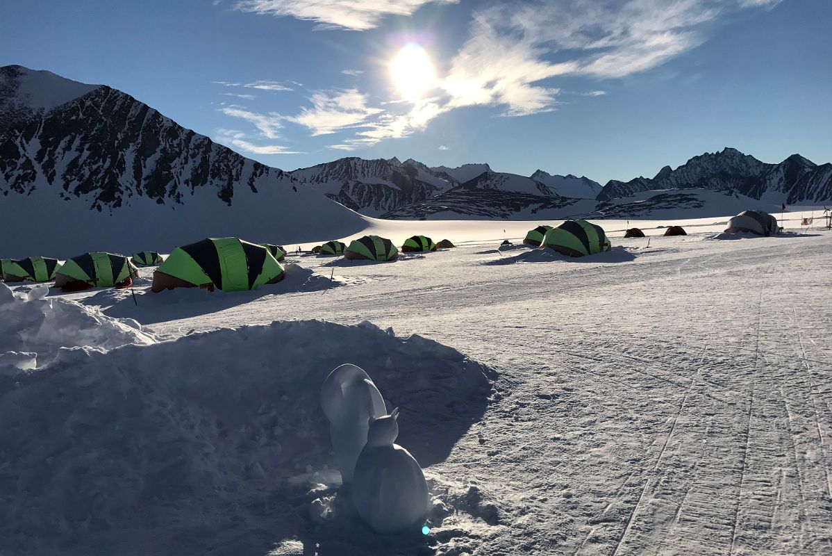 04B The 24 Hour Sun Shines On The Tents Of Union Glacier Camp Antarctica At One Thirty In The Morning With Emperor Penguin Ice Sculpture